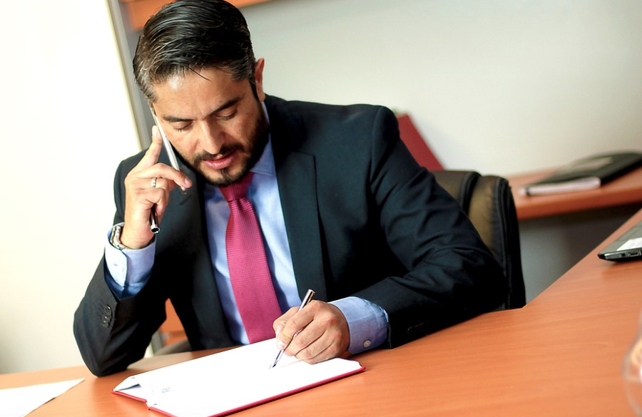 fake lawyer and legal firms businessman talking on phone